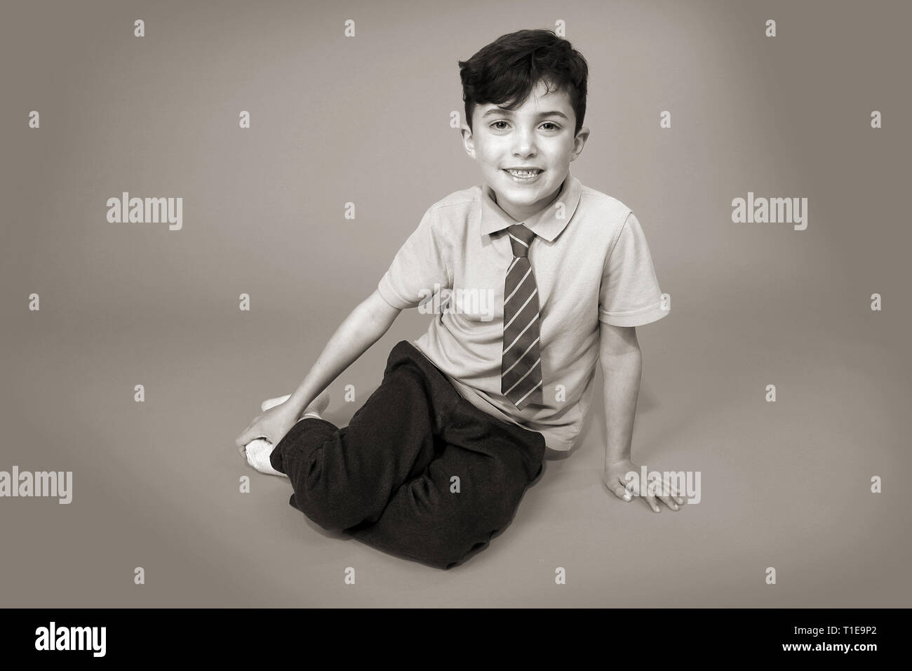 happy young boy in school uniform Stock Photo