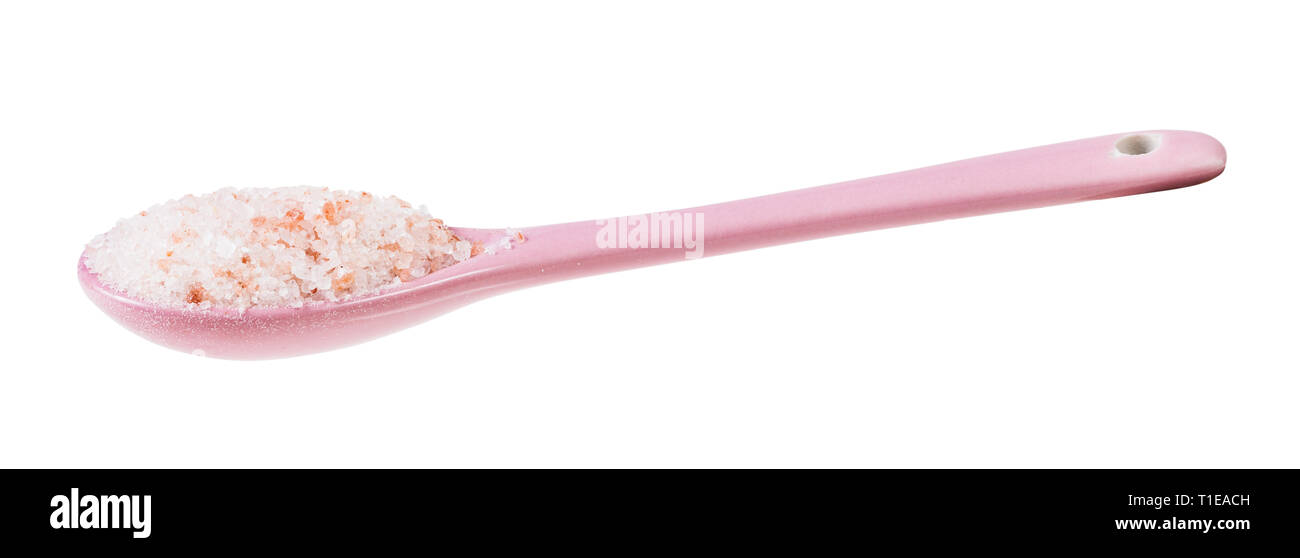 side view of ceramic spoon with pink Himalayan Salt isolated on white background Stock Photo