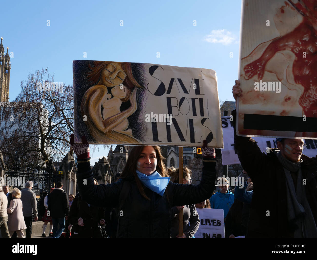 London, UK. 25th March, 2019. A group of young people on a March for Life demonstration on Parliament Square, London, UK and walk to Westminster Bridge for a 9 minutes protest to highlight that since David Steel's Abortion Act 1967, 9 million abortions have been performed in the UK. Credit: Joe Kuis / Alamy Live News Stock Photo