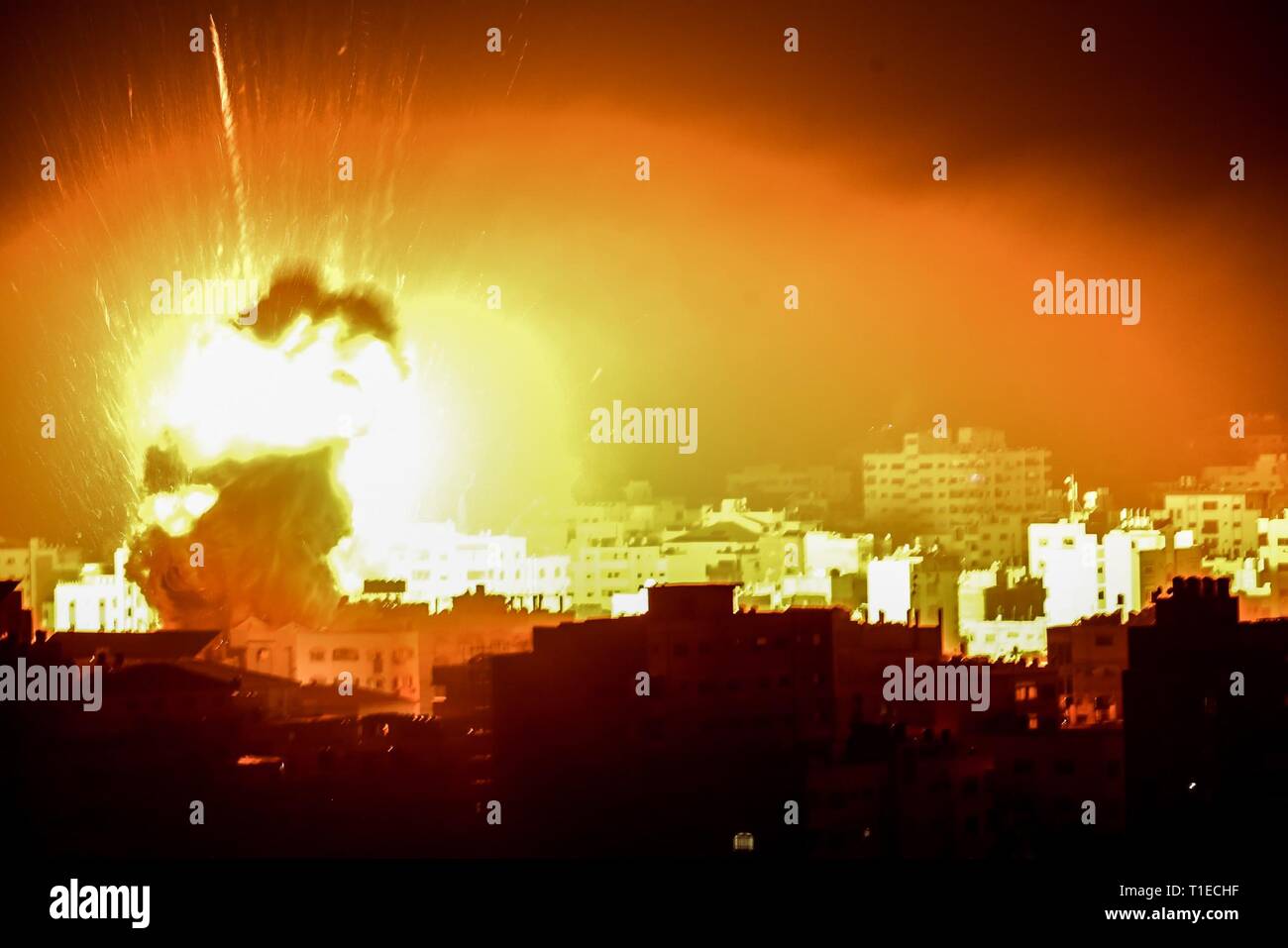 Gaza City, Gaza Strip. 25th Mar, 2019. A ball of fire rise over Gaza city, Israeli warplanes strikes on sites all over the Gaza strip in response to a rocket attack on Tel Aviv. Credit: Abed Alrahman Alkahlout/Quds Net News/ZUMA Wire/Alamy Live News Stock Photo