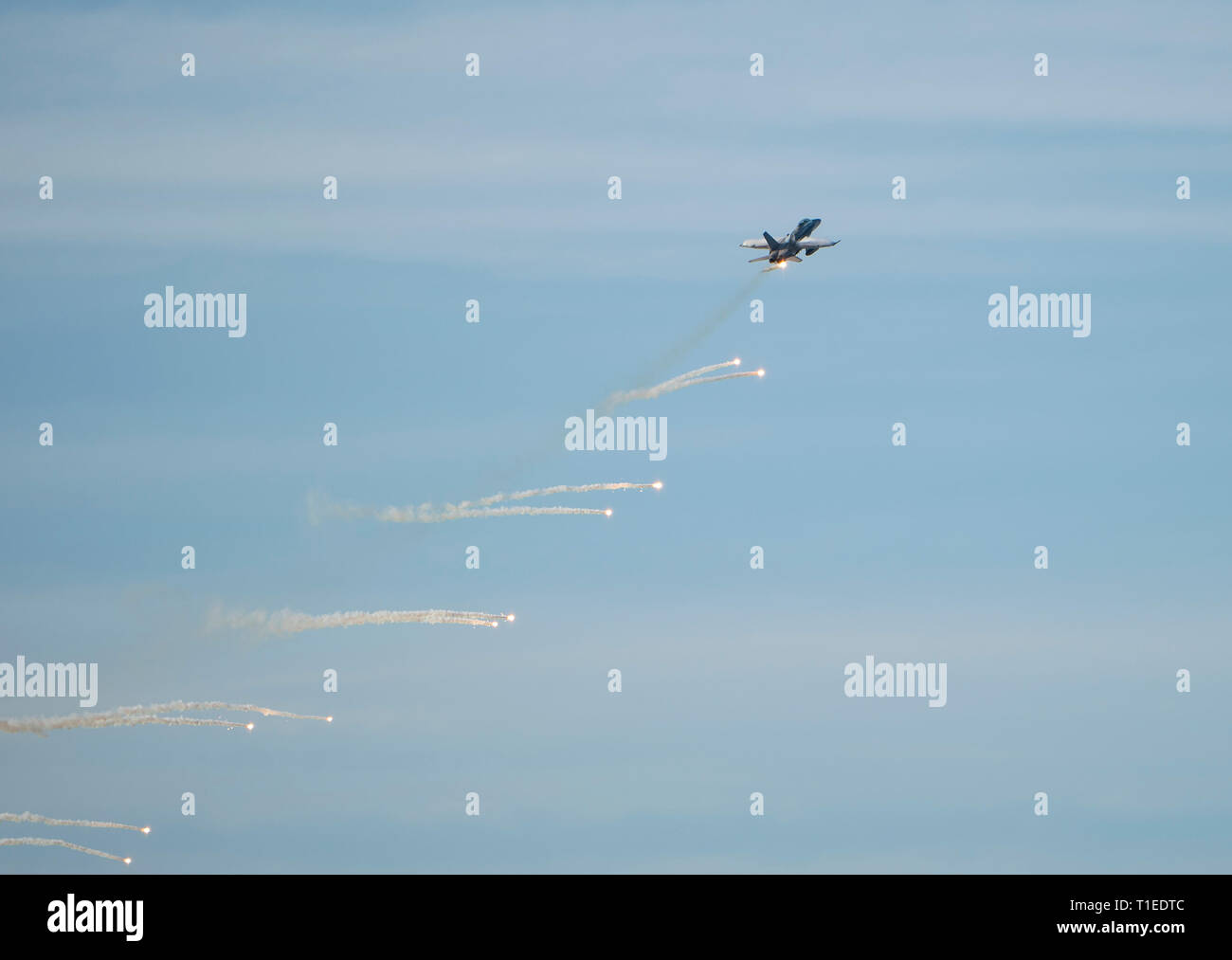 Langkawi, Malaysia. 26th March 2019. Aerial display by Malaysian Airforce Hornet shooting flares at the LIMA exhibition Credit: Chung Jin Mac/Alamy Live News Stock Photo