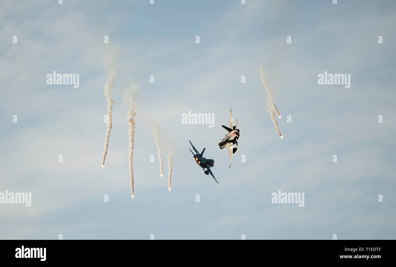 Langkawi, Malaysia. 26th March 2019. Aerial display by Malaysian Airforce Hornet shooting flares at the LIMA exhibition Credit: Chung Jin Mac/Alamy Live News Stock Photo