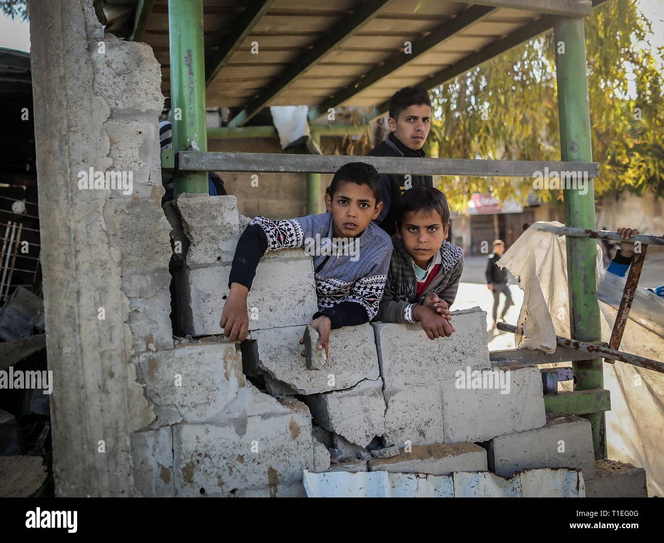 Gaza City, The Gaza Strip, Palestine. 26th Mar, 2019. Damages in houses around offices of Hamas politburo chief Ismail Haniyeh in Gaza city after Israeli airstrikes, Gaza hit by Israel after Hamas denies rocket attack on Tel Aviv. Credit: Abed Alrahman Alkahlout/Quds Net News/ZUMA Wire/Alamy Live News Stock Photo