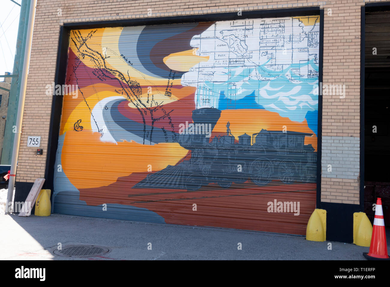 Garage door painted with Locomotive steam engine depicting the heart of railroad and industry located in the Midway area. St Paul Minnesota MN USA Stock Photo