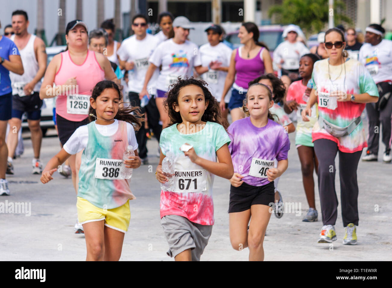 Miami Beach Florida,Ocean Drive,South Pointe 5K Run,benefit,charity,runners,running,race,compete,Hispanic woman female women,girl girls,youngster,kids Stock Photo