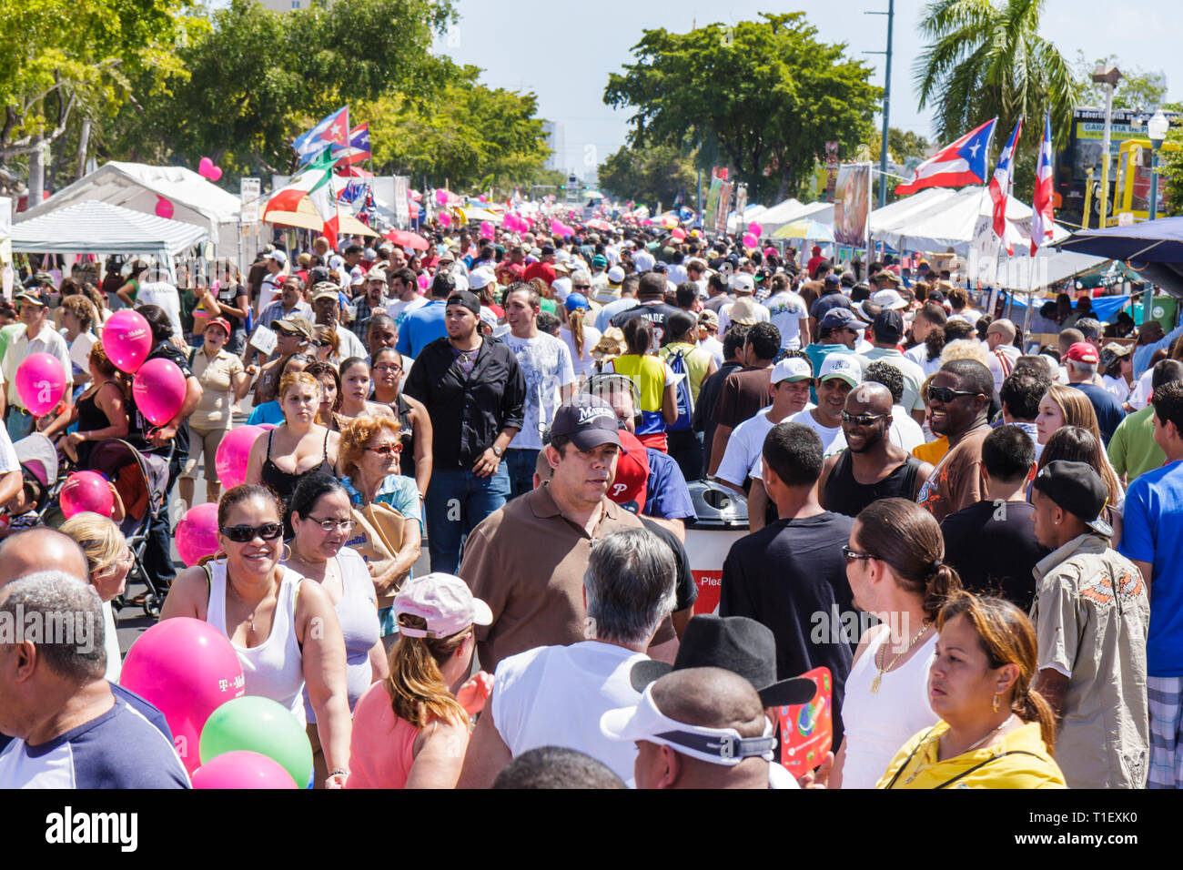 Miami Florida,Little Havana,Calle Ocho,festival,street fair,Hispanic man men male,woman female women,walking,strolling,multi ethnic,crowd,stall,stalls Stock Photo