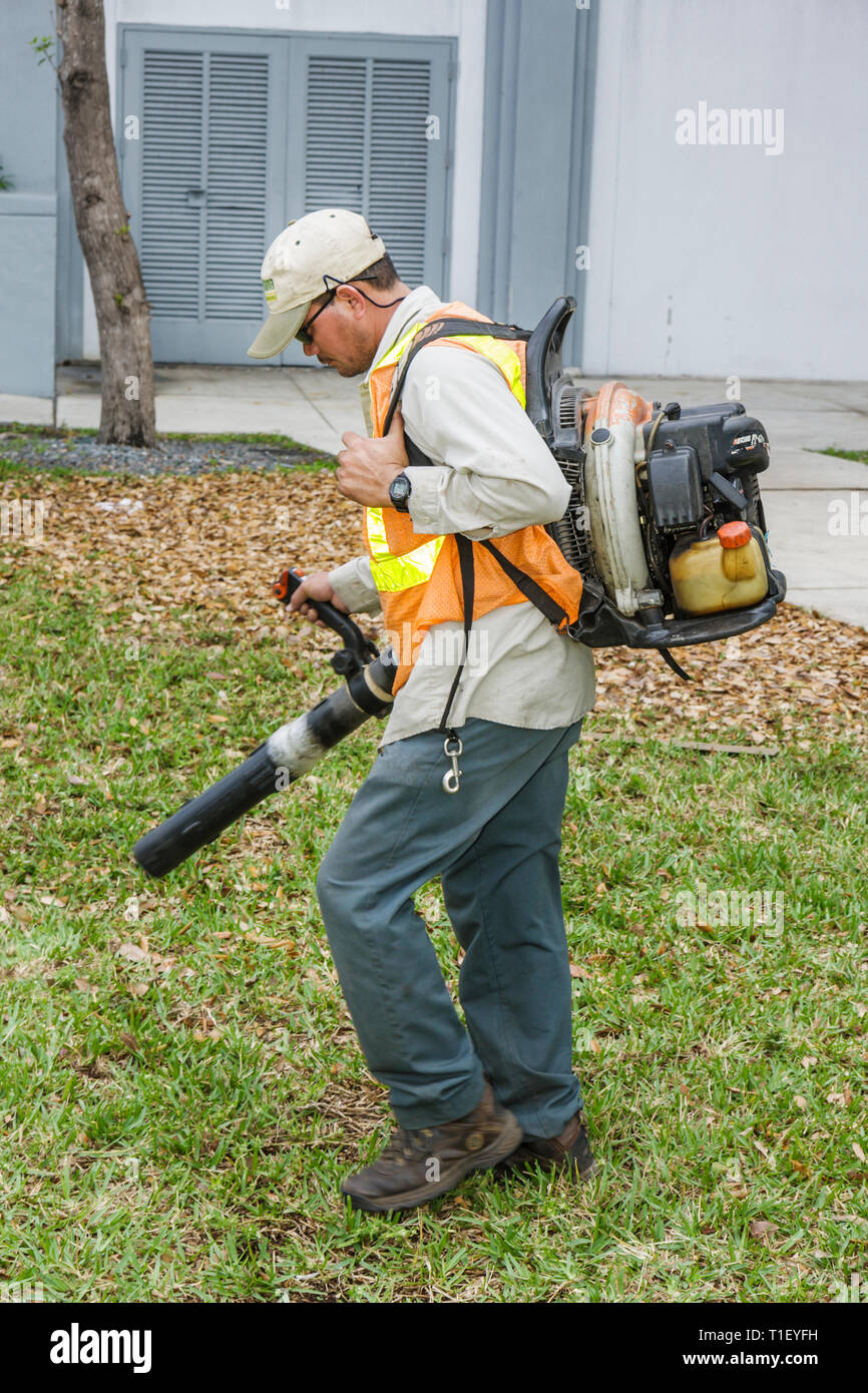 Hispanic man using leaf blower hi-res stock photography and images - Alamy