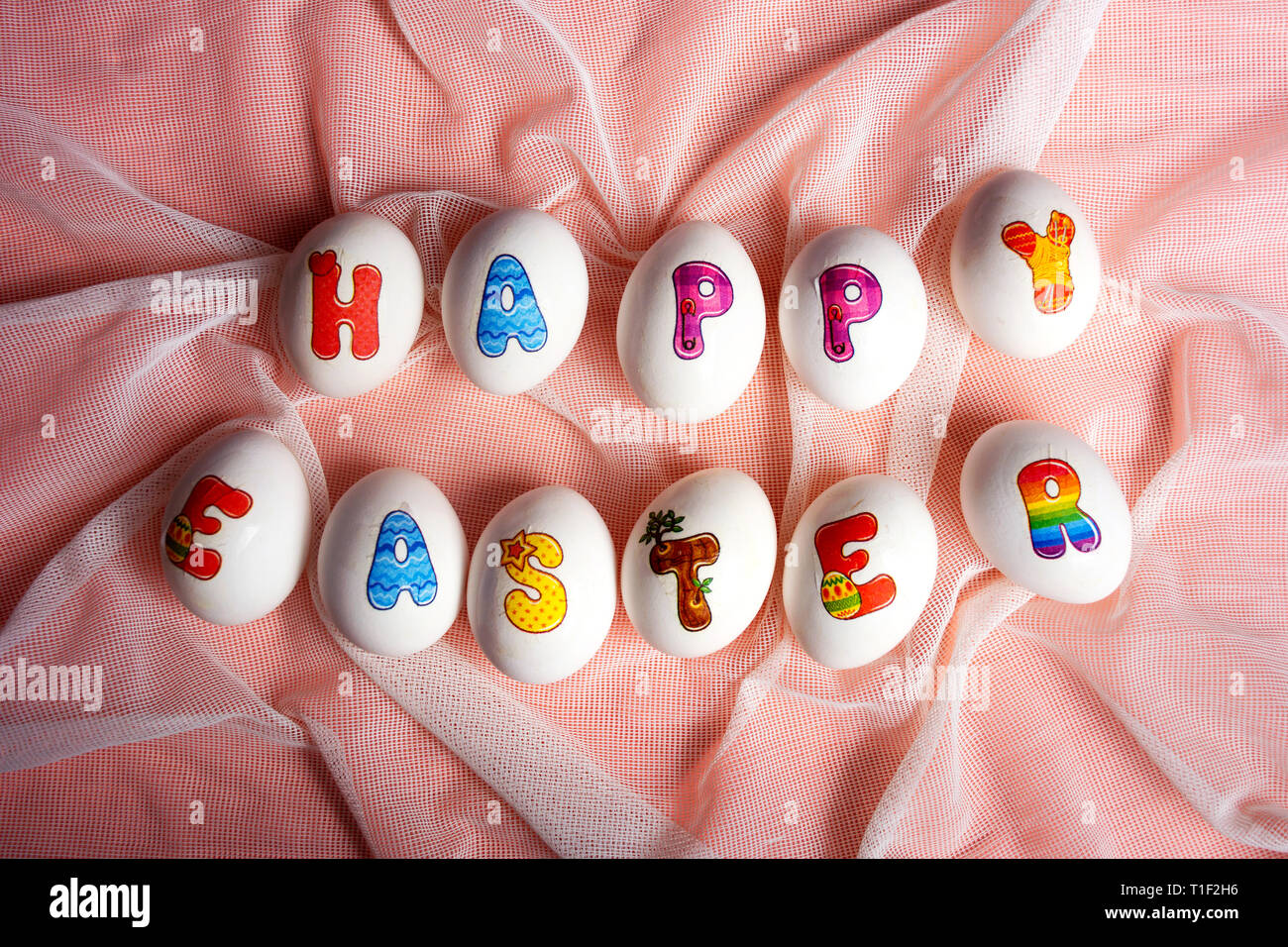 Happy Easter note written on eggs flat lay Stock Photo