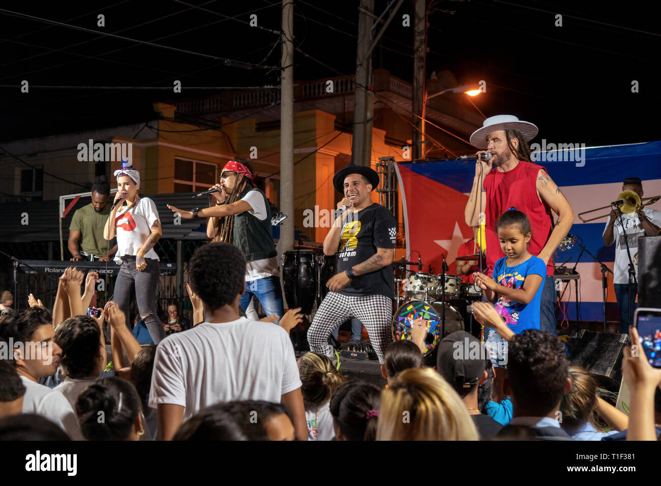 Santa Clara, Cuba - January 27 2019: Night performance of the qva libre musical group seen from the public. Young people watching the performance of t Stock Photo