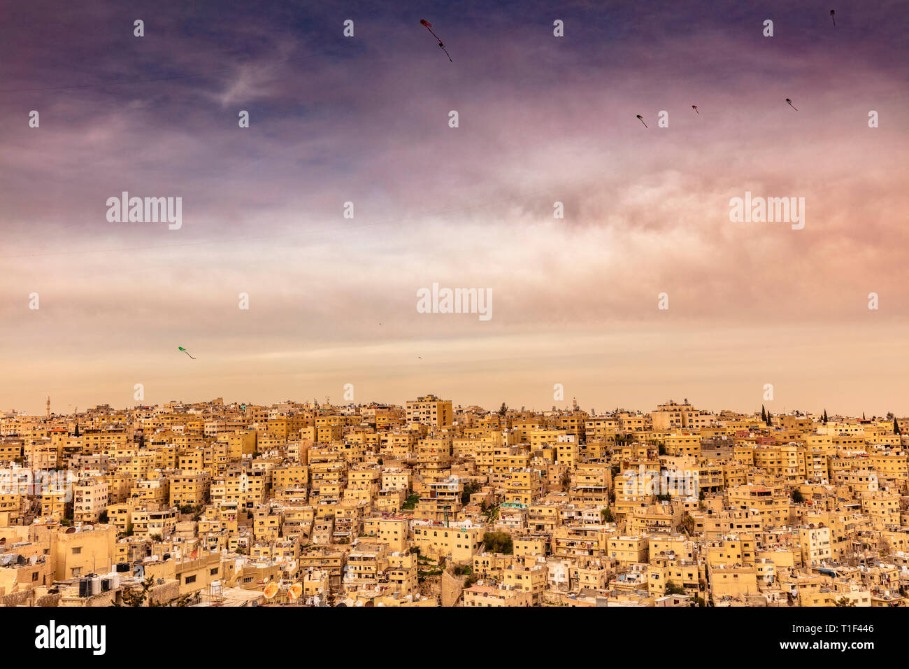 Amman, Jordan, view of the old city, a large complex of decaying buildings overlooking the citadel located on Jabal Al Qal'a. Kites in the sky. Stock Photo