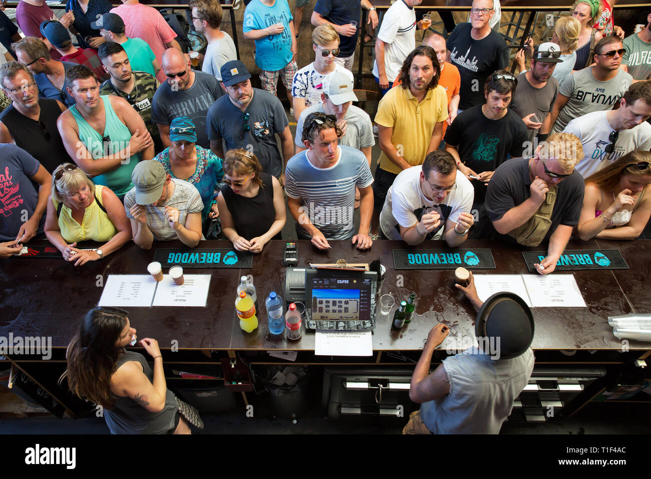 THE HAGUE - People at the bar of local beer brewery KOMPAAN during the beer and barbeque festival Stock Photo