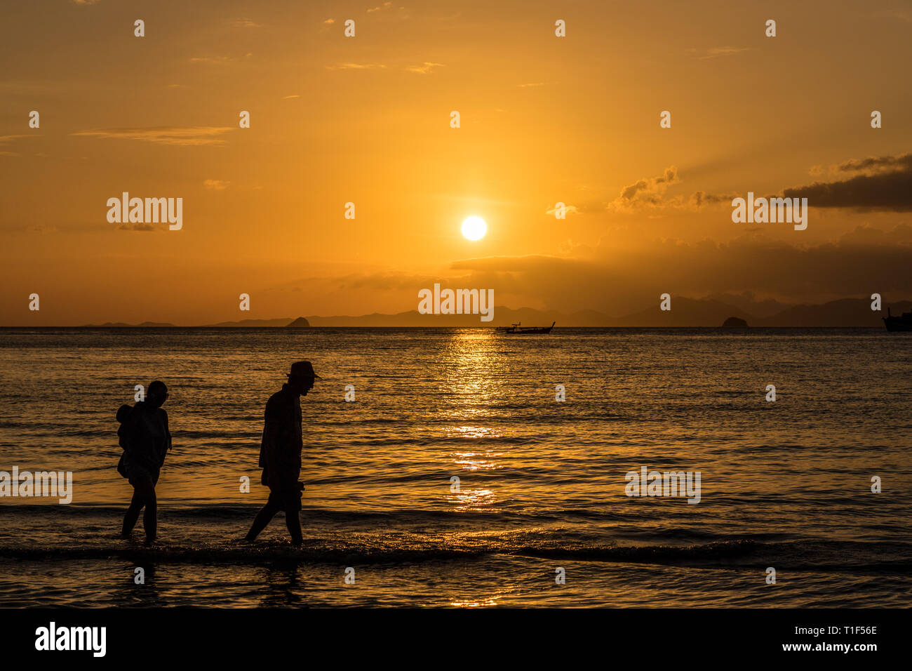 Sunset at Ao Nang beach in Thailand Stock Photo