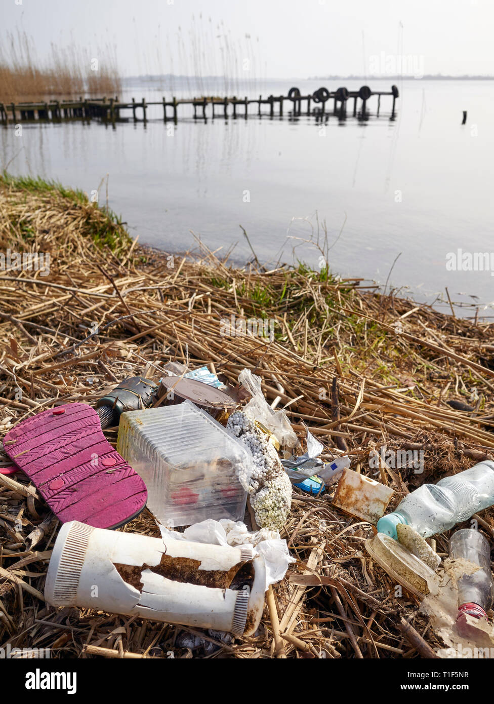 Garbage left by a river bank, environment pollution problem concept picture. Stock Photo