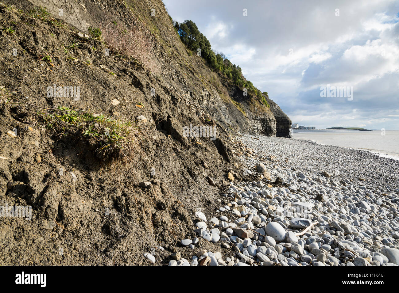 Earth and mud at the base of cliffs due to erosion Stock Photo