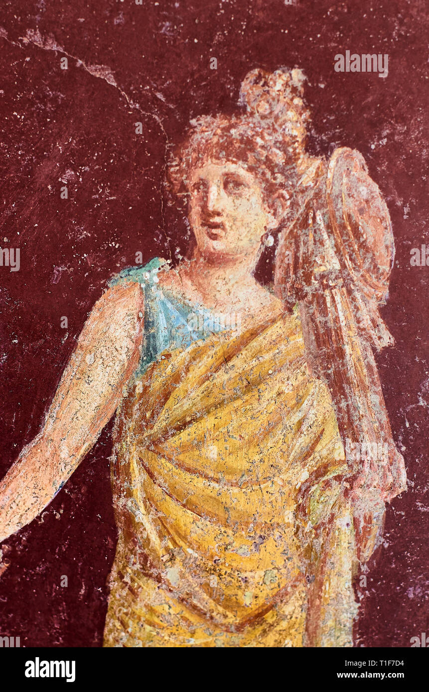 Figure of a woman painted in a Fresco in a Domus of Pompeii, Italy