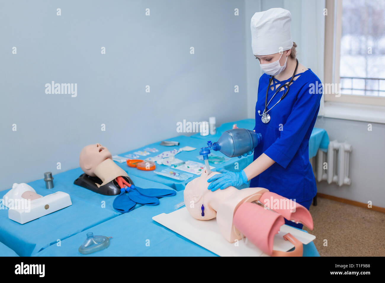 Artificial ventilation. introduction endotracheal tube (ETT) into trachea to ensure airway patency. doctor saves a life Stock Photo