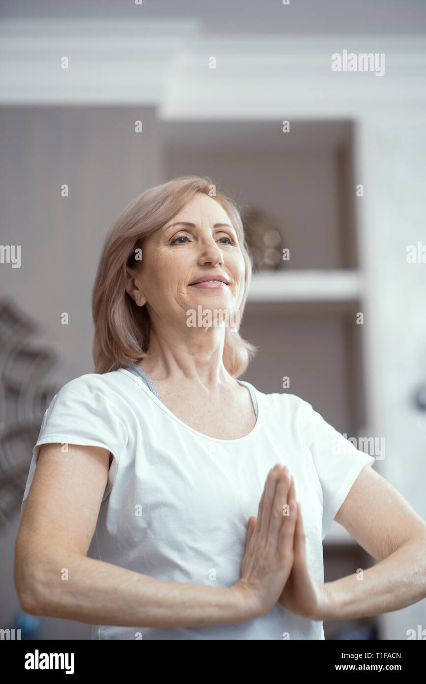 Woman doing yoga meditation Stock Photo - Alamy