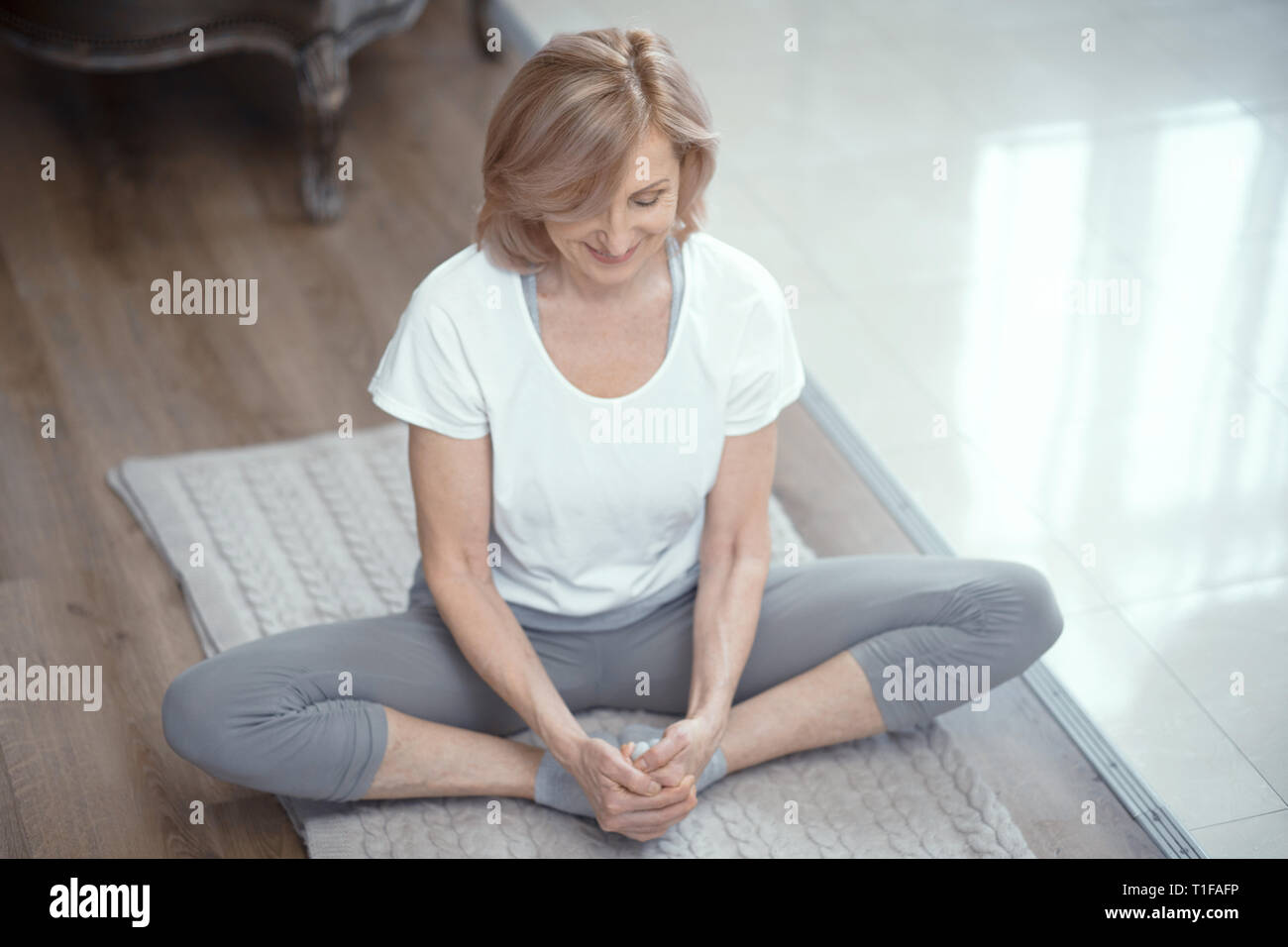 Beautiful fit mature woman sitting hi-res stock photography and images ...