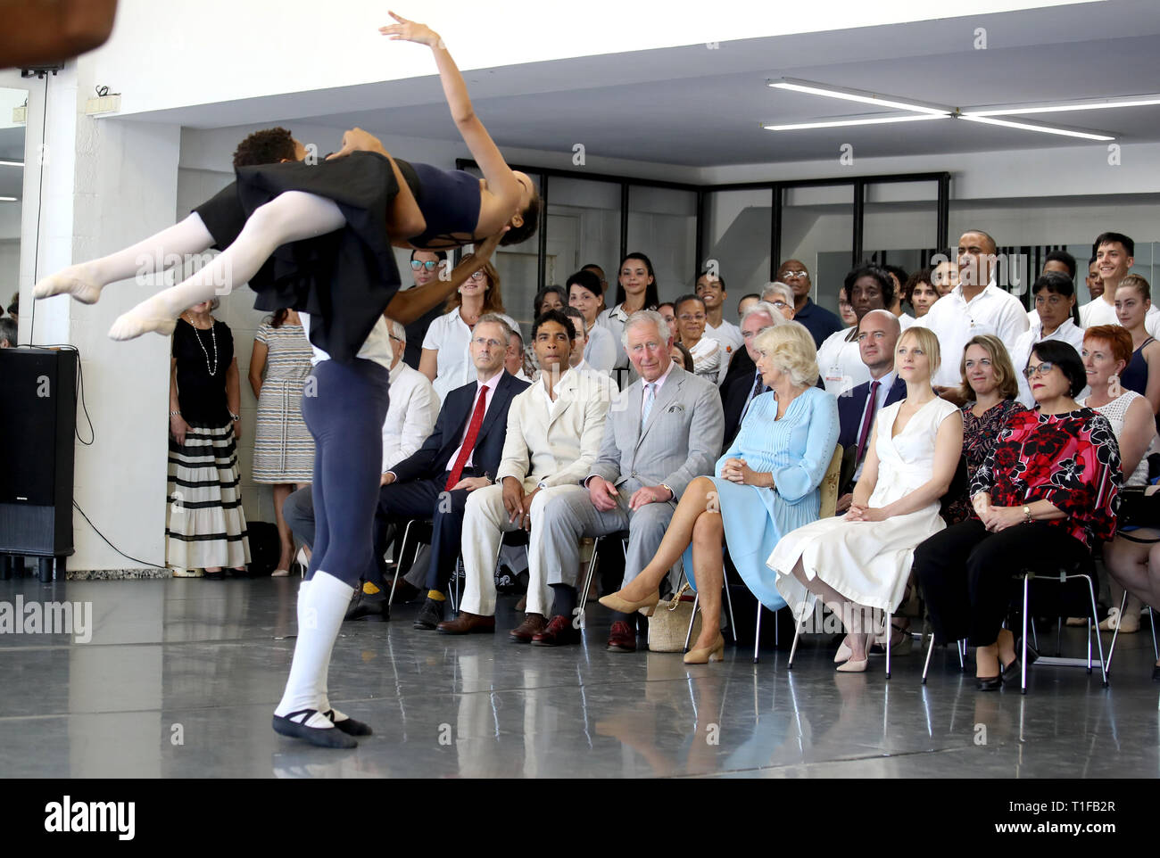 The Prince of Wales and The Duchess of Cornwall, with founder and director Carlos Acosta, watch a performance during a visit to the Acosta Dance Company in Havana, Cuba. Stock Photo