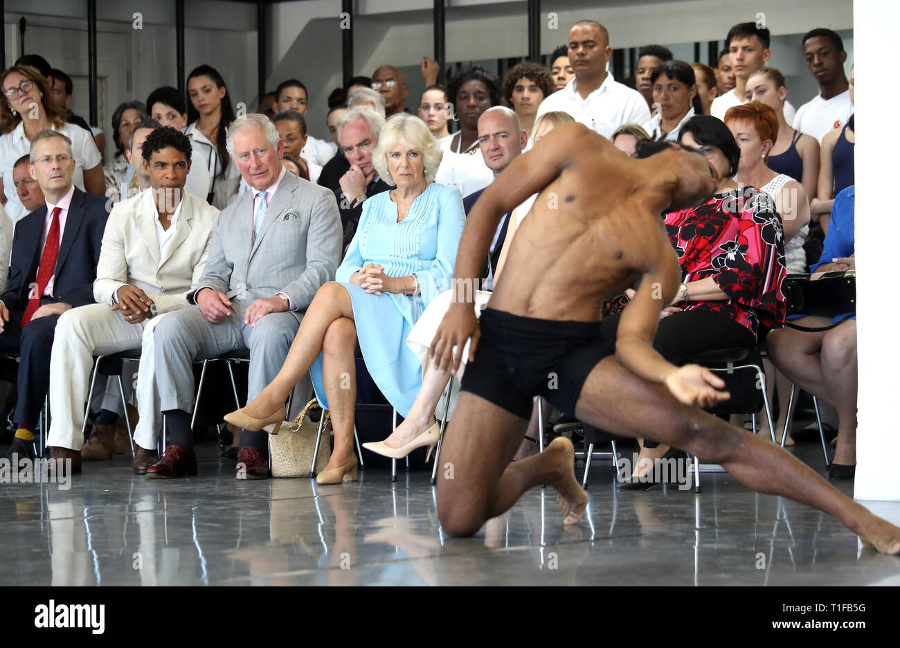 The Prince of Wales and The Duchess of Cornwall, with founder and director Carlos Acosta, watch a performance during a visit to the Acosta Dance Company in Havana, Cuba. Stock Photo