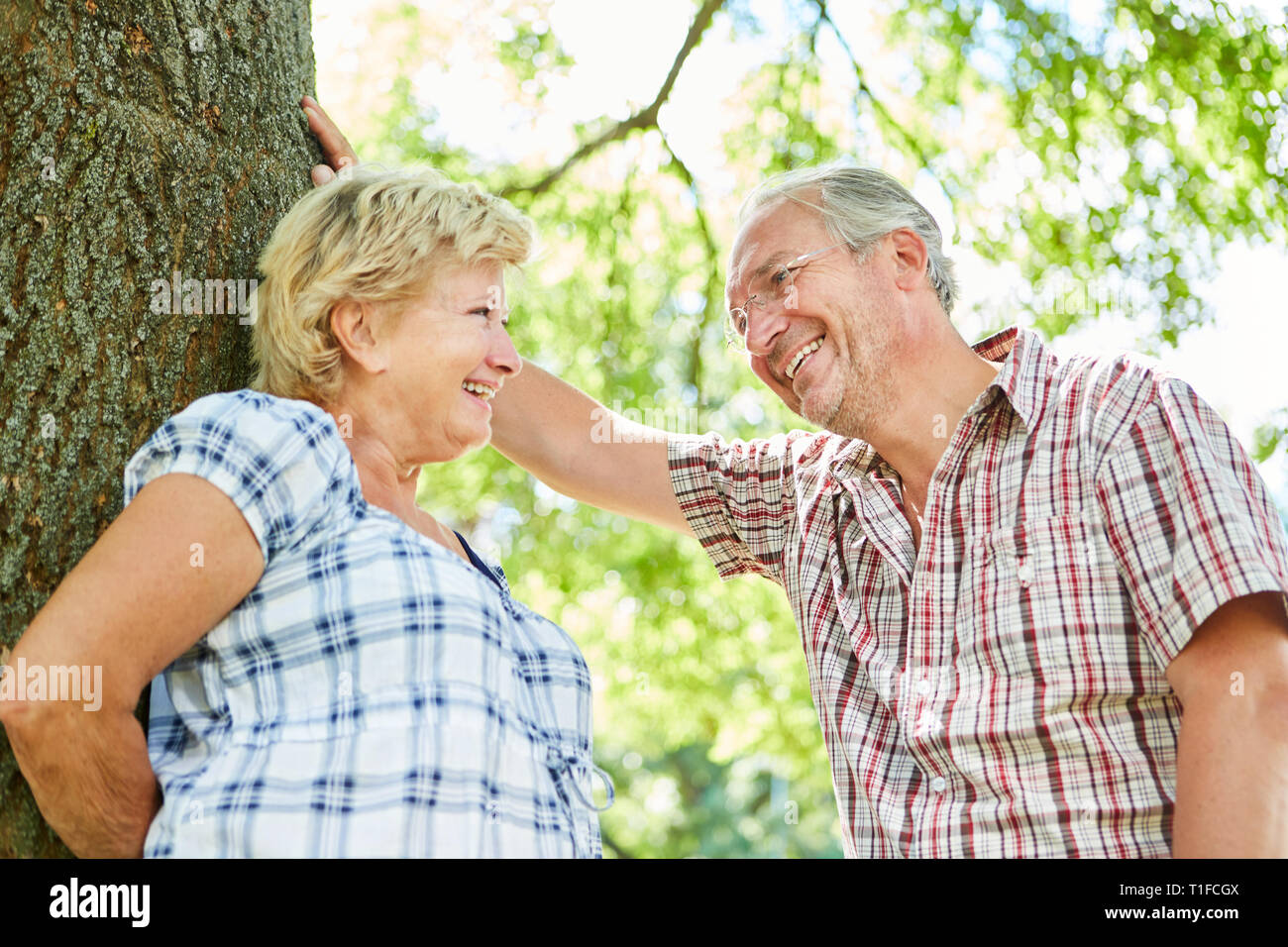 Amorous senior couple getting to know each other while dating in the summer Stock Photo