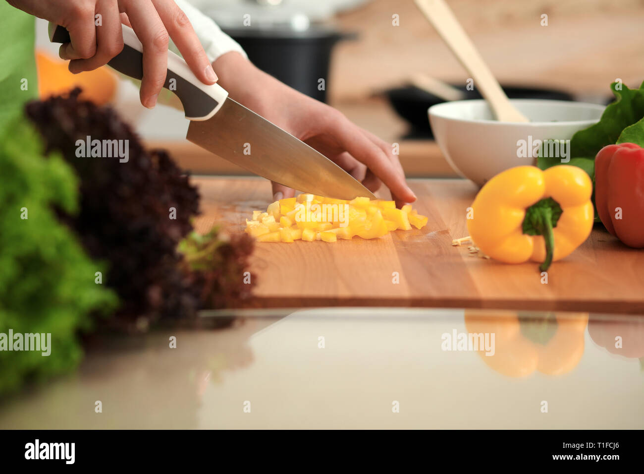 Unknown Human Hands Cooking In Kitchen Woman Slicing Yellow Bell Pepper Healthy Meal And Vegetarian Food Concept Stock Photo Alamy