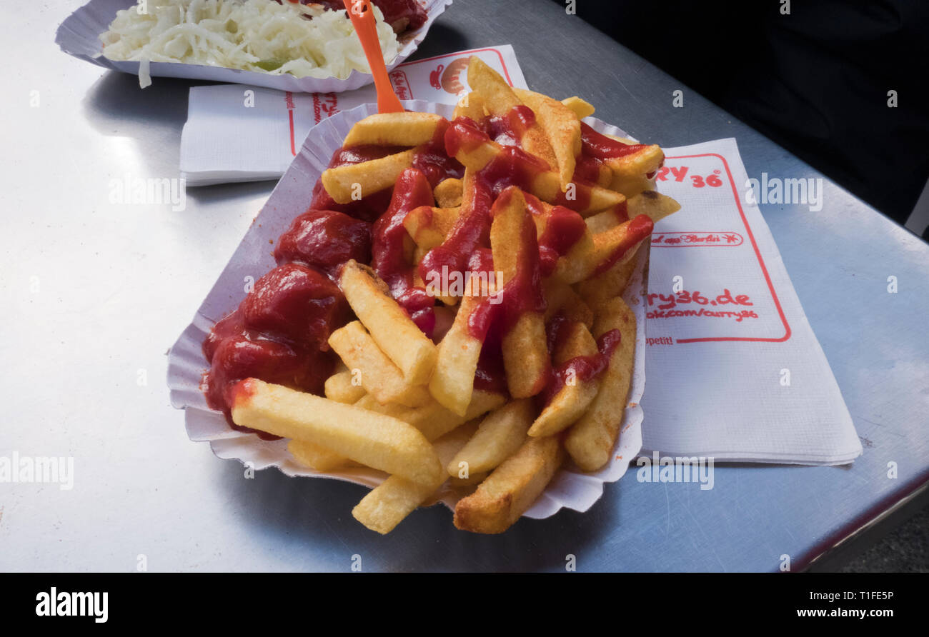 Curry Wurst with chips a popular street fod in Berlin Germany Stock Photo