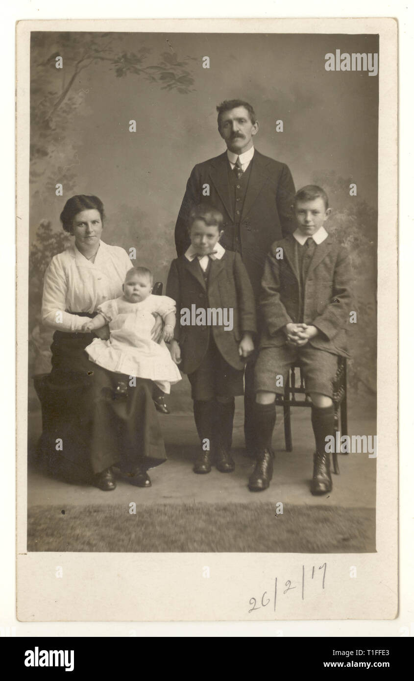 WW1 era studio formal family portrait postcard, dated 26 Feb 1917 Stock Photo