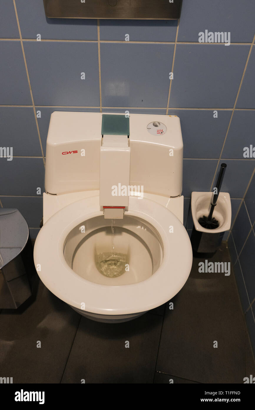 Self cleaning toilet with rotating seat in Berlin Germany Stock Photo