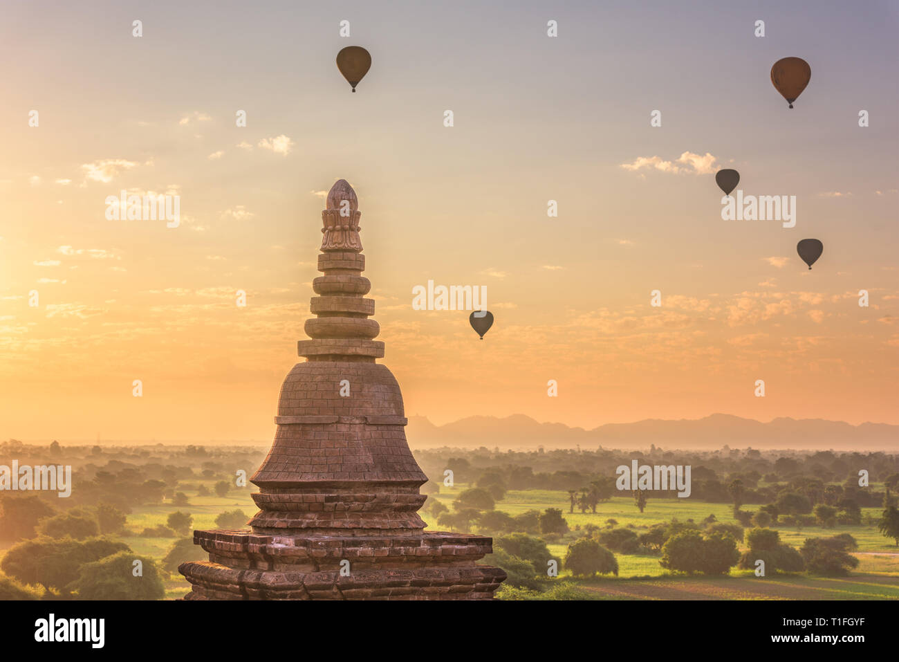 Bagan, Myanmar ancient temple ruins landscape in the archaeological zone at dusk. Stock Photo