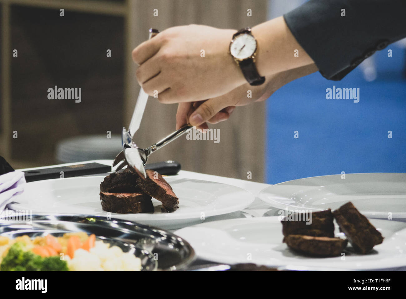 Roast beef and slice, chef's hands cutting roast beef, Carving roast