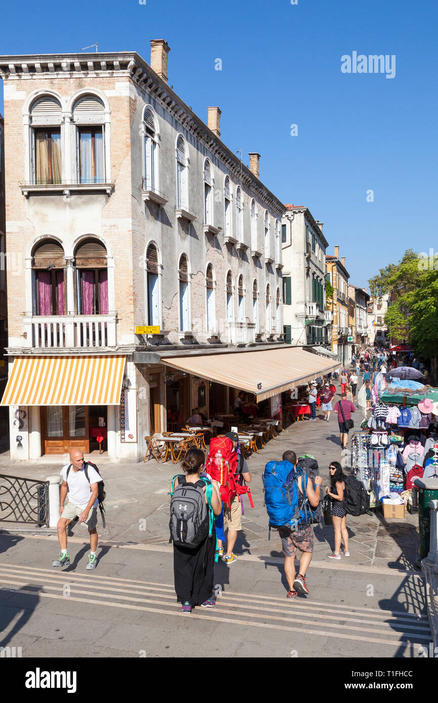 Street scene in Strada Nova, Cannaregio, Venice, Veneto, Italy with people walking, shops and restaurants in historic buildings. Thoroughfare from sta Stock Photo