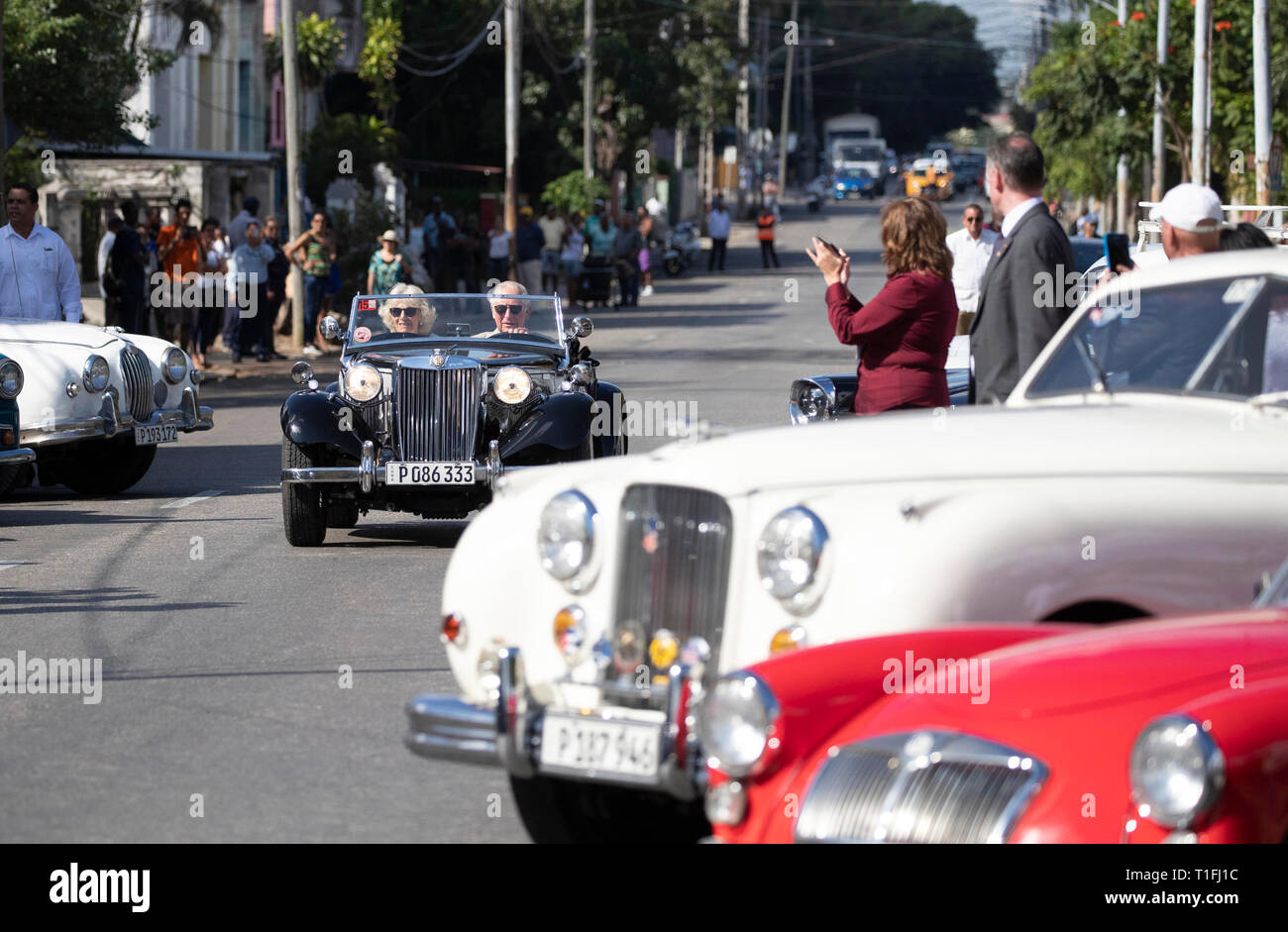 The Prince of Wales and the Duchess of Cornwall ride in an MG TD sportscar from 1953 as they arrive at a British Classic Car event in Havana, Cuba, that is part of an historic trip which celebrates cultural ties between the UK and the Communist state. Stock Photo
