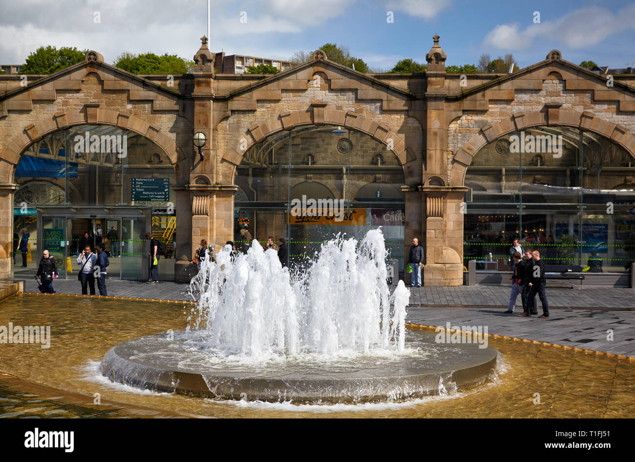 SHEFFIELD, ENGLAND - MAY 8, 2009: The view of the fountain on the Sheaf Square in front of Sheffield railway station building. South Yorkshire. Englan Stock Photo