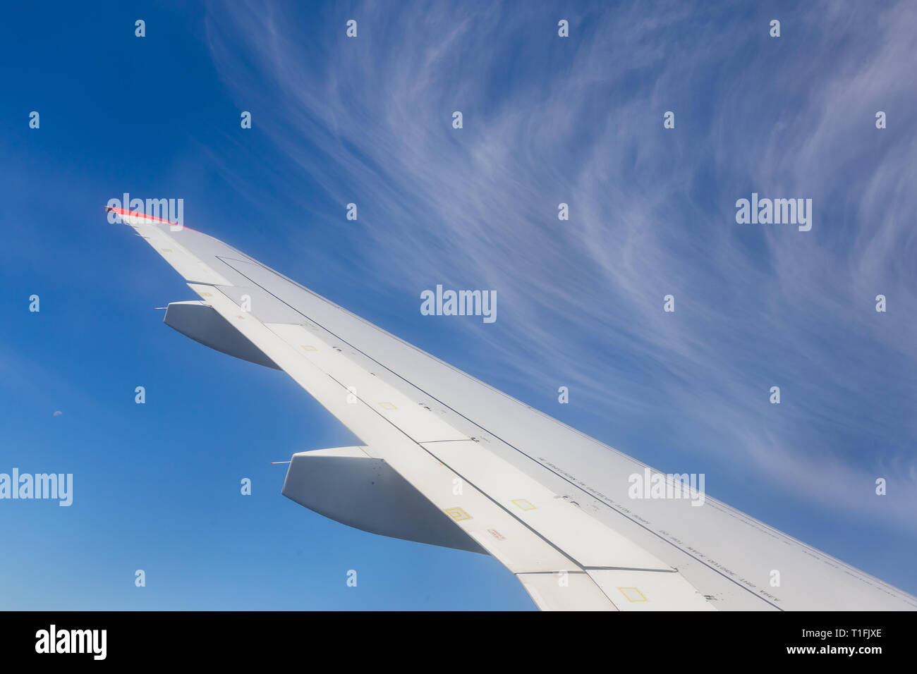 View from airplane window with blue sky and white clouds Stock Photo ...