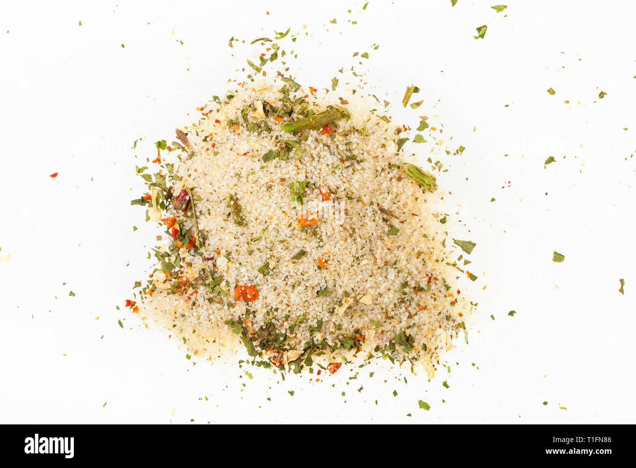 top view of pile of seasoned salt with dried vegetables and flavours on