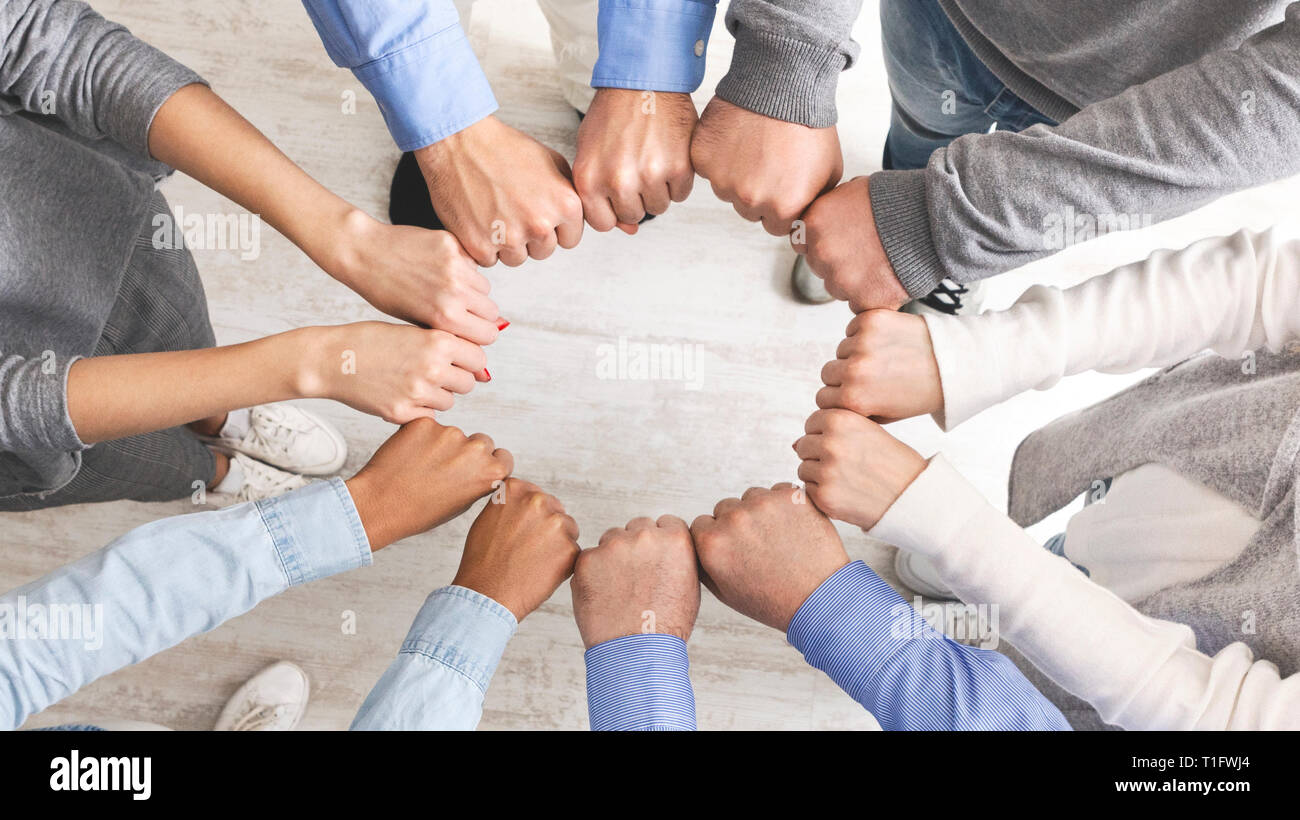 Group of people fist bump assemble together Stock Photo