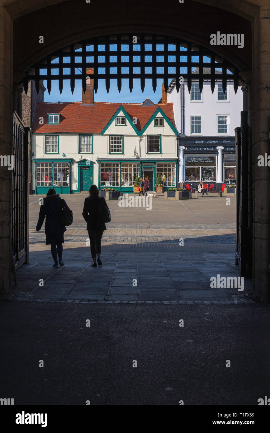 Bury St Edmunds Abbey Gate, view from the medieval Abbey Gate towards shops sited on Angel Hill in the centre of Bury St Edmunds, Suffolk, UK. Stock Photo