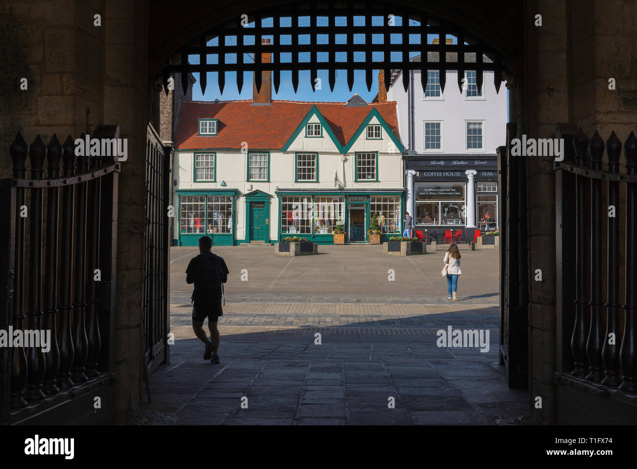 Bury St Edmunds town, view from the medieval Abbey Gate towards shops sited on Angel Hill in the centre of Bury St Edmunds, Suffolk, UK. Stock Photo