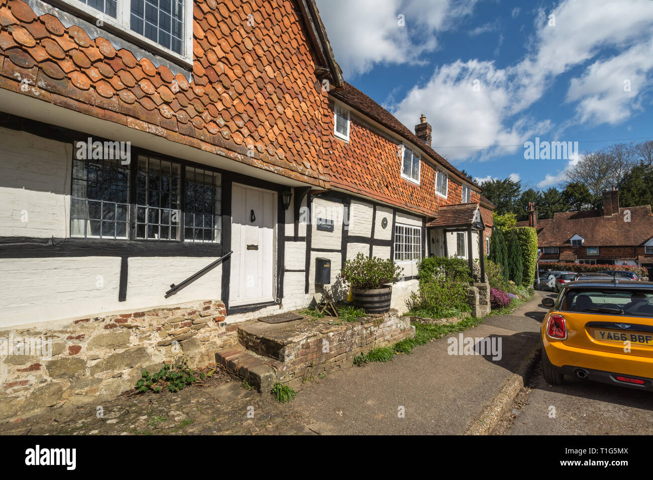 Church Steps Cottage, a pretty timber framed building, in the village of Witley in Surrey, UK, during spring. Stock Photo