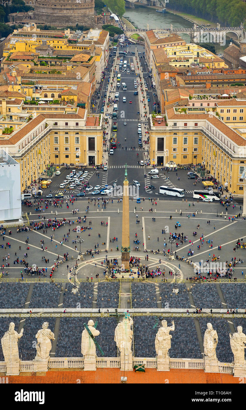 Aerial view of Rome and the Vatican city. St Peter's square from the Basilica dome. Preparations for the Easter Service - empty chairs, and tourists Stock Photo