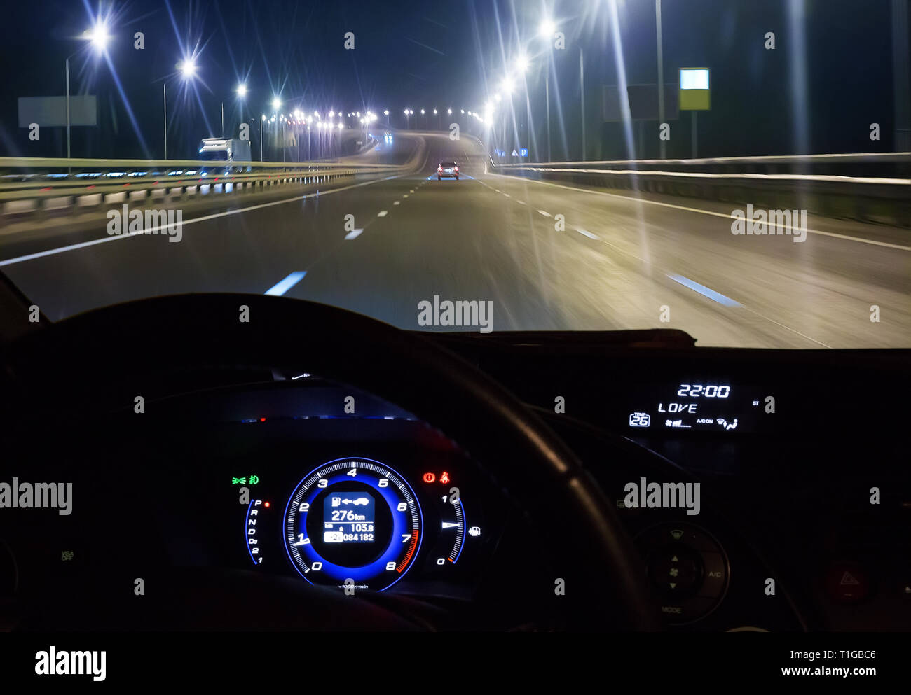 Driving in city night view from car interior hi-res stock photography ...