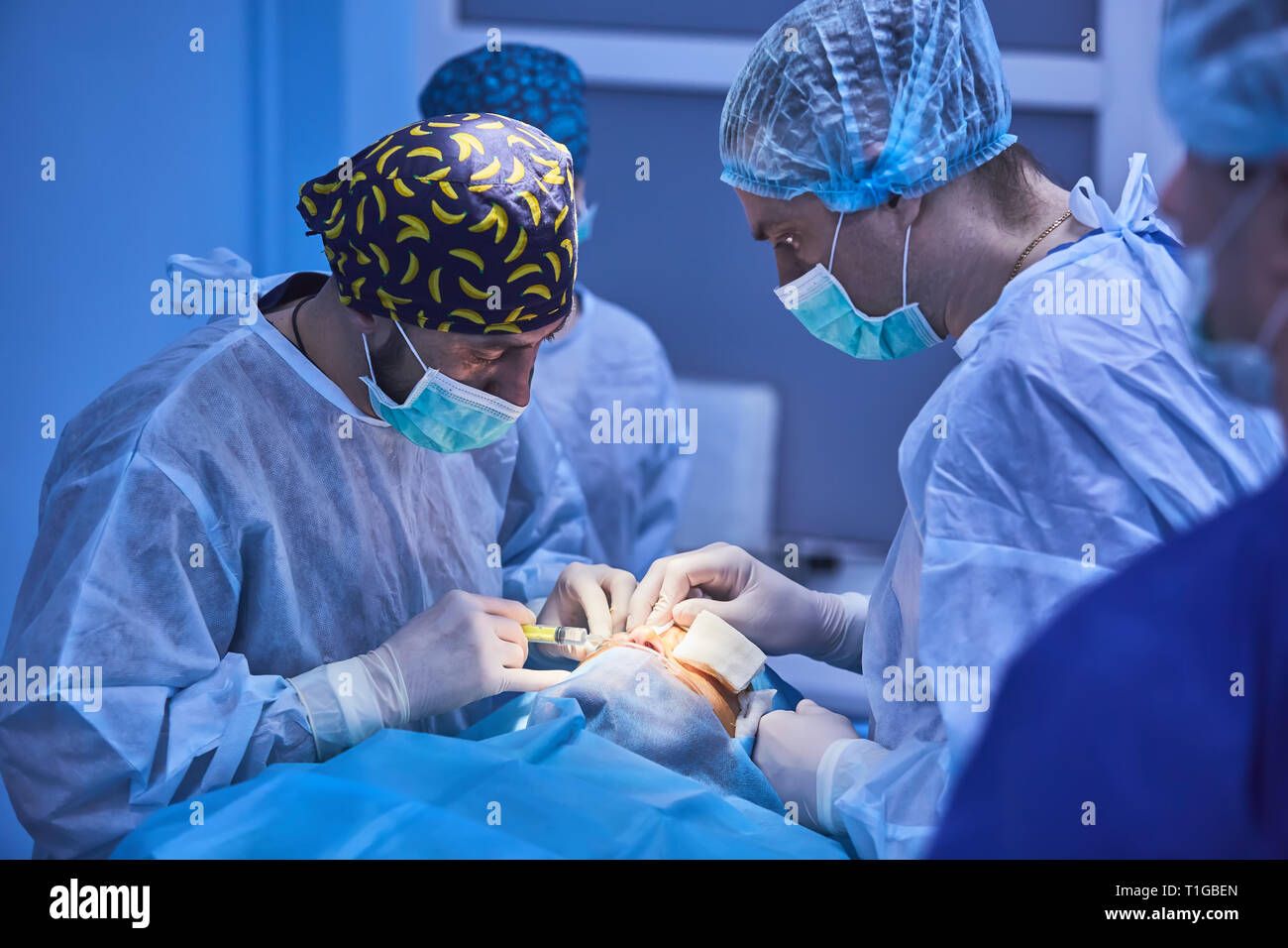 Medical Team Performing Surgical Operation in Modern Operating Room ...