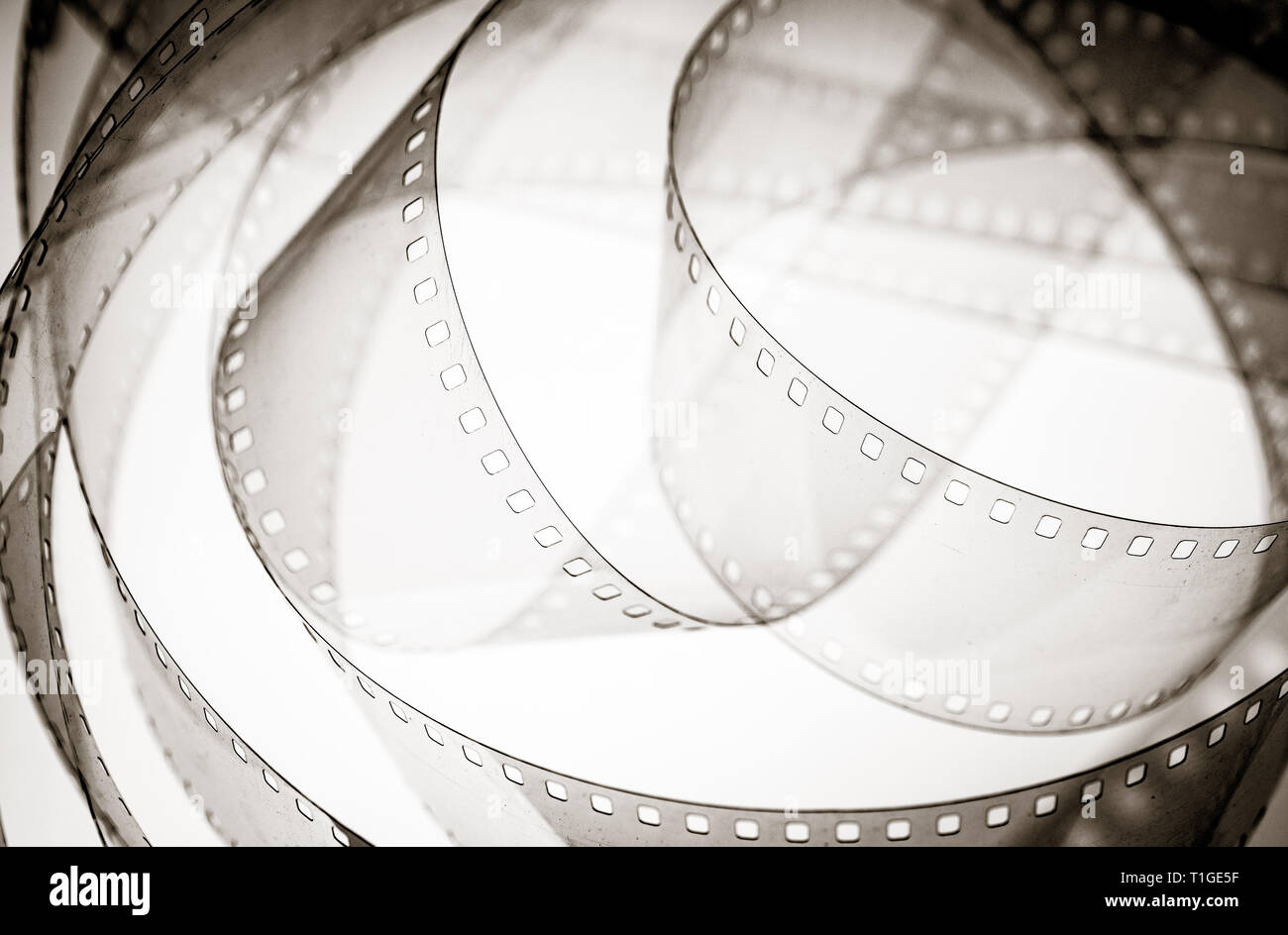 Close up of unrolled camera film reel transparent empty frames vintage ...