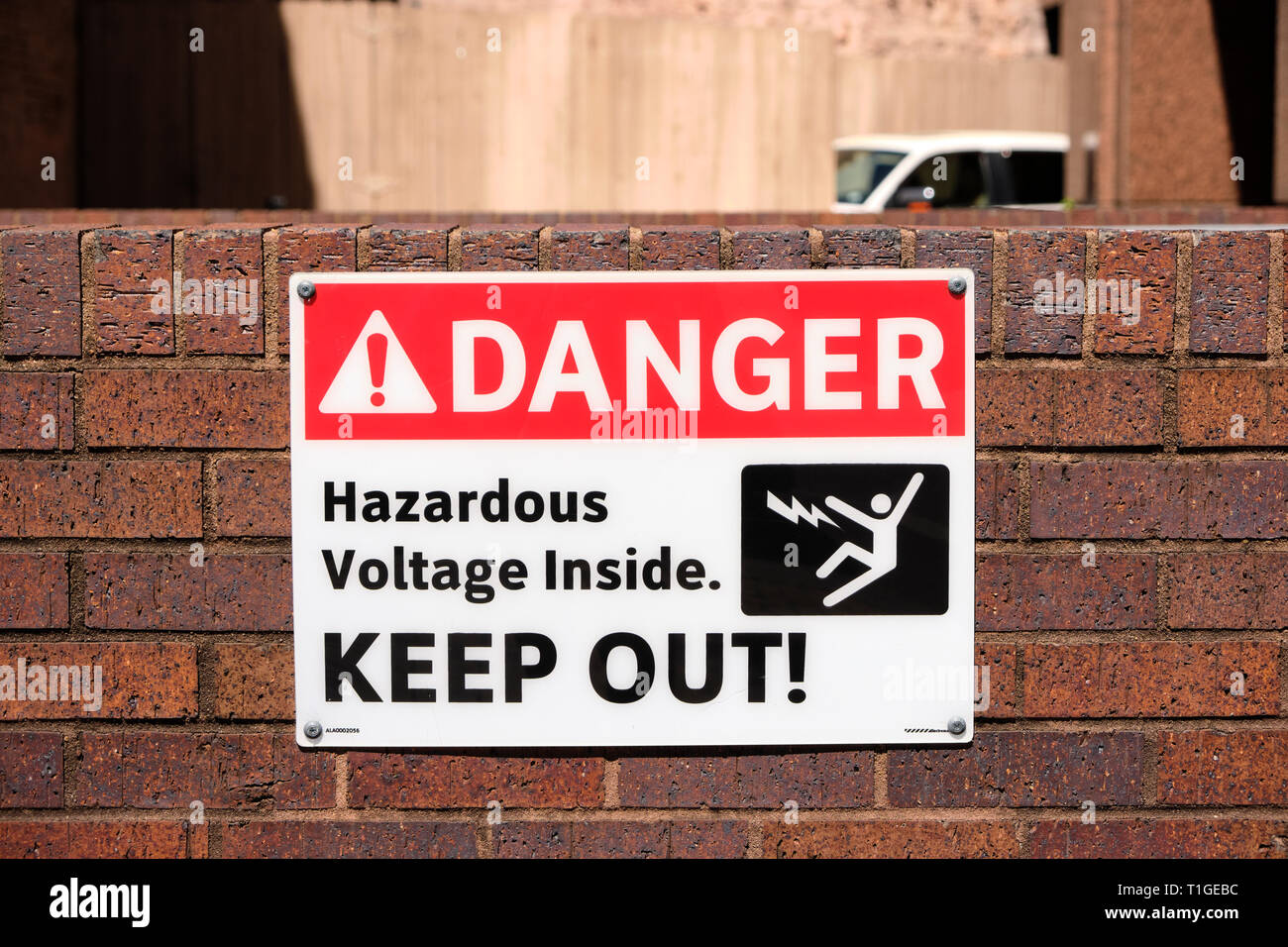 Danger sign or hazard sign, warning of hazardous high voltage power or electric lines and advising to keep out in Montgomery Alabama, USA. Stock Photo