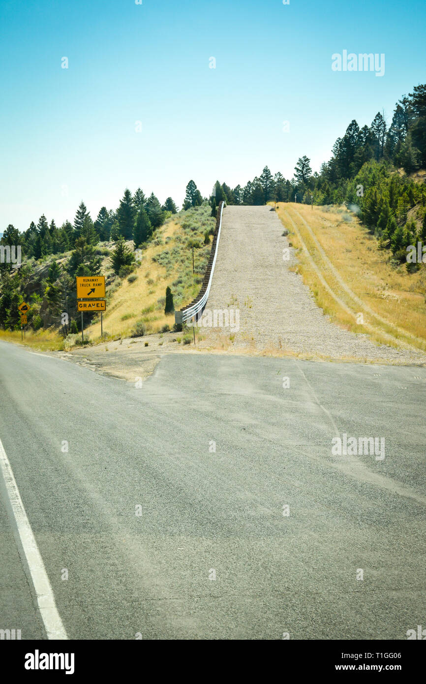A roadside safety feature for runaway trucks, an uphill ramp of gravel to stop a big rig from brake failure on a highway in Western Montana Stock Photo