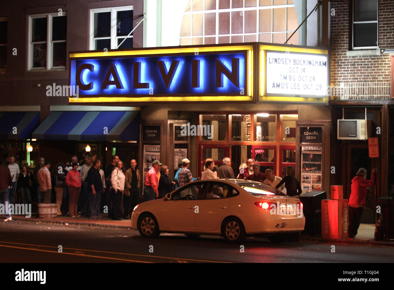 Concert fans are shown in line while entering the Calvin Theater in