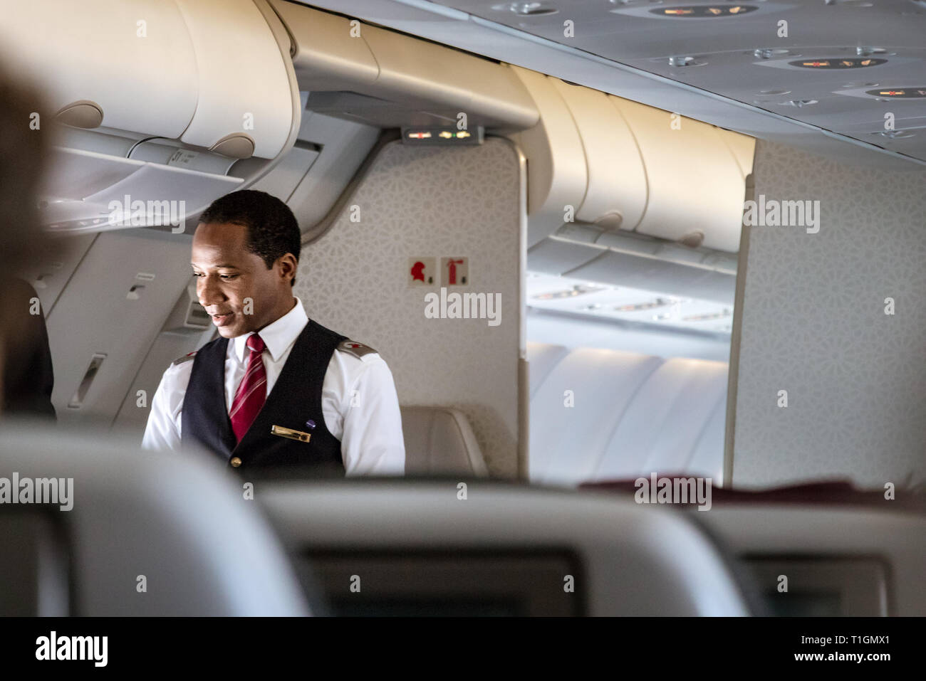 Qatar airways cabin crew hi-res stock photography and images - Alamy