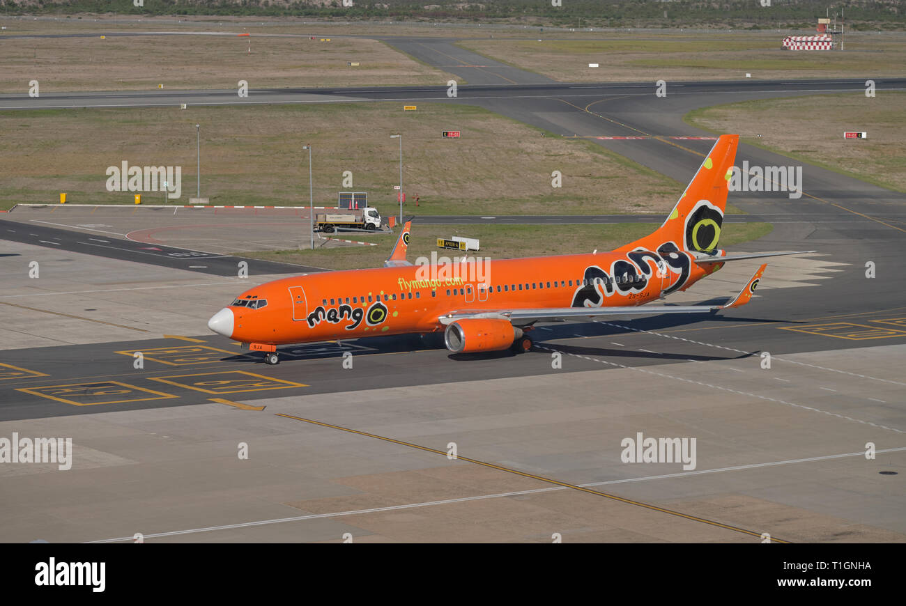 Mango airlines plane taxi on runway. View of full plan and logo at airport in Cape Town , South Africa Stock Photo