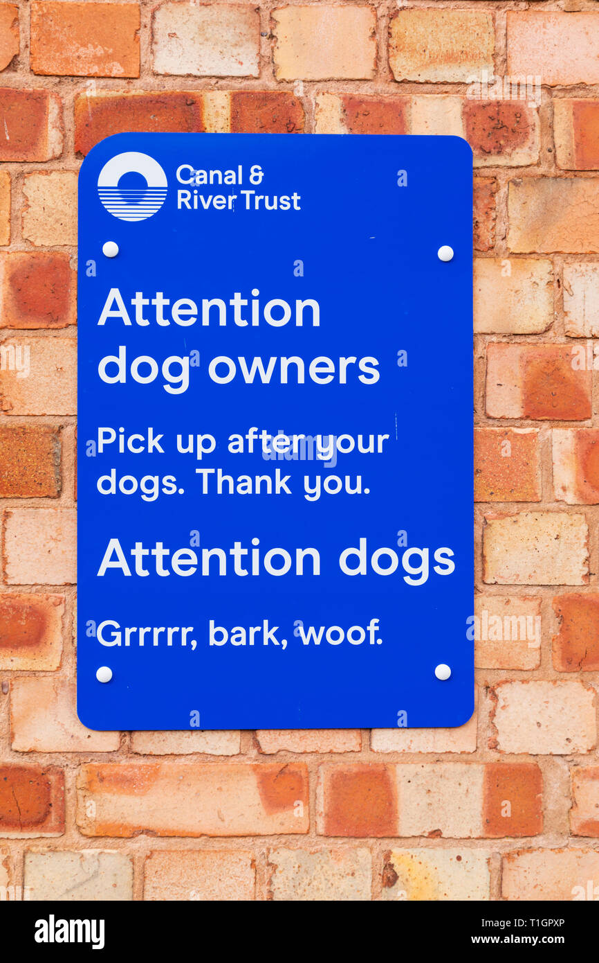 Canal Trust sign for dog owners to clean up after thier dog. Also written in dog. Town lock on the River Trent, Newark on Trent, Nottinghamshire, Stock Photo